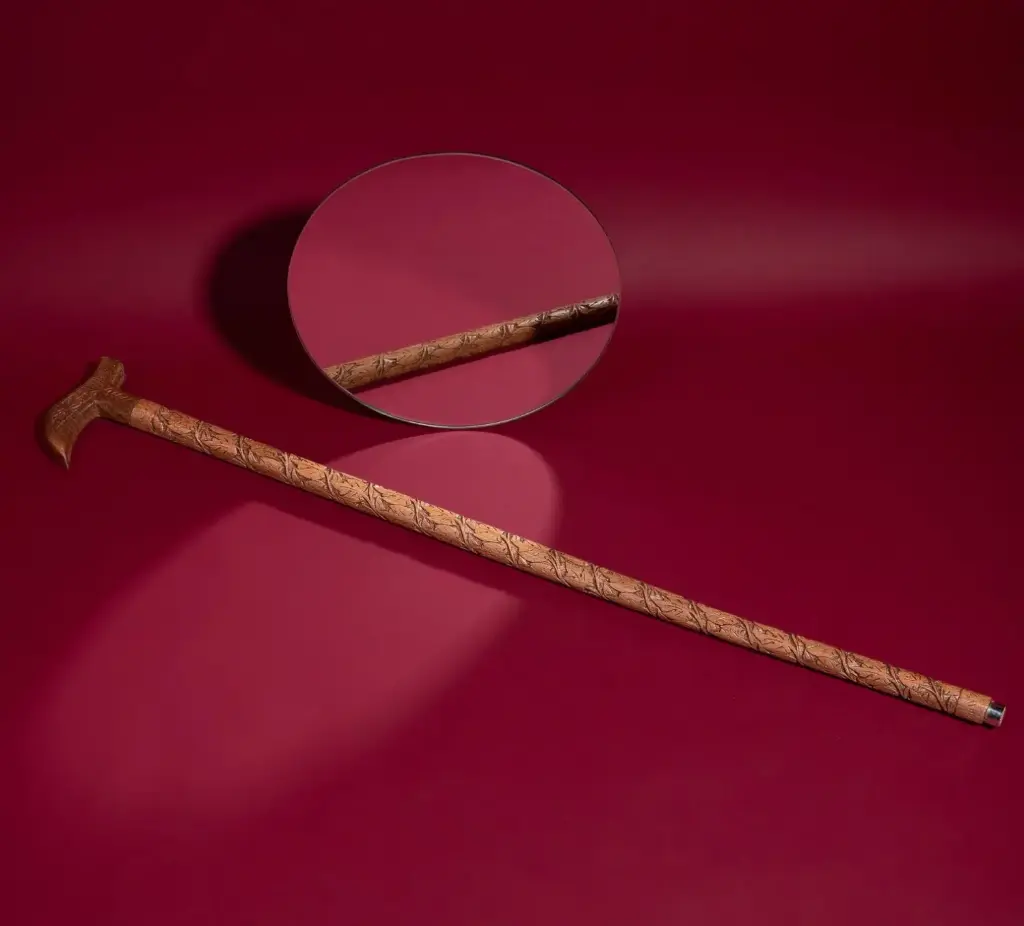 Walking Stick intricately carved out of Walnut wood